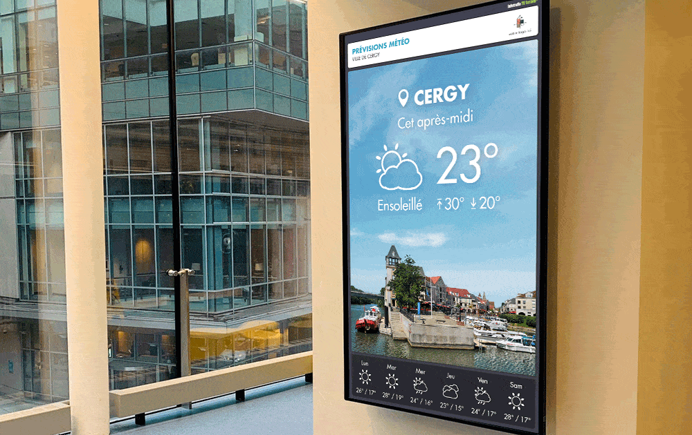 Écran mural d'affichage dynamique dans un hall d'entreprise affichant la météo